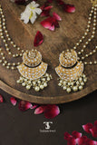 Close-up of chaandbali earrings with detailed stone work