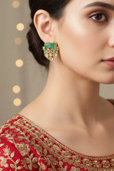 Close-up of traditional stud earrings with intricate design