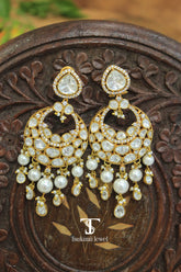 Gold finish chaandbali earrings with traditional Indian design