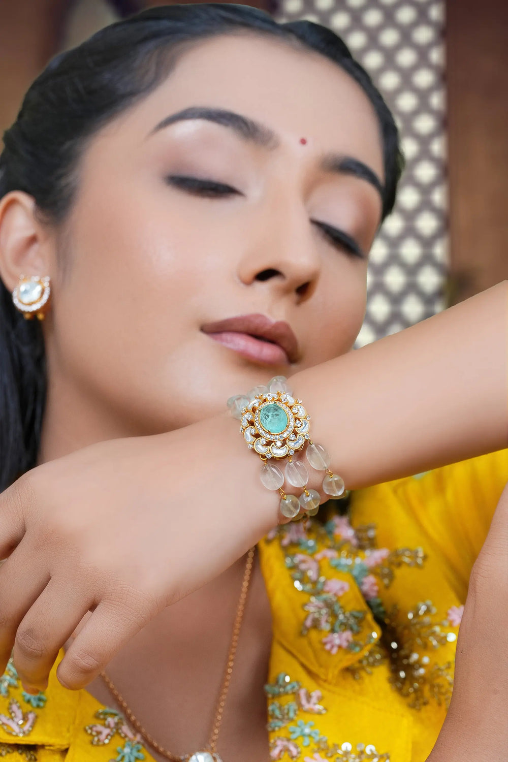 Gold toned kundan bracelet perfect for festive wear