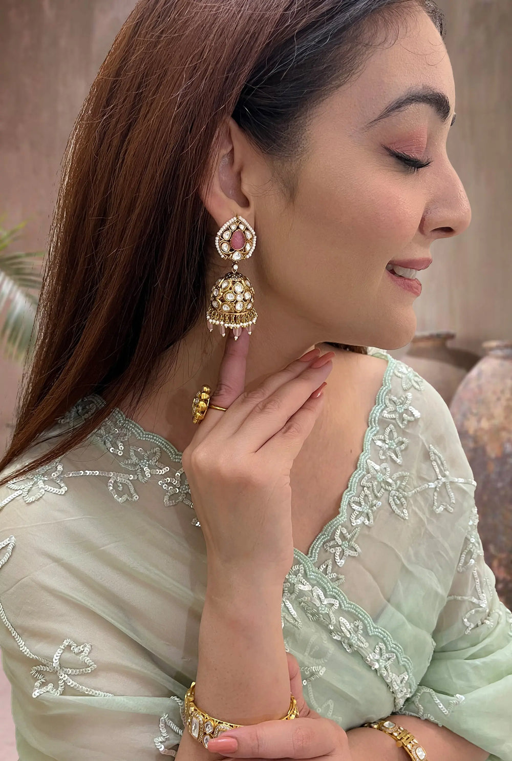 Gold toned polki jhumka earrings for festive occasions