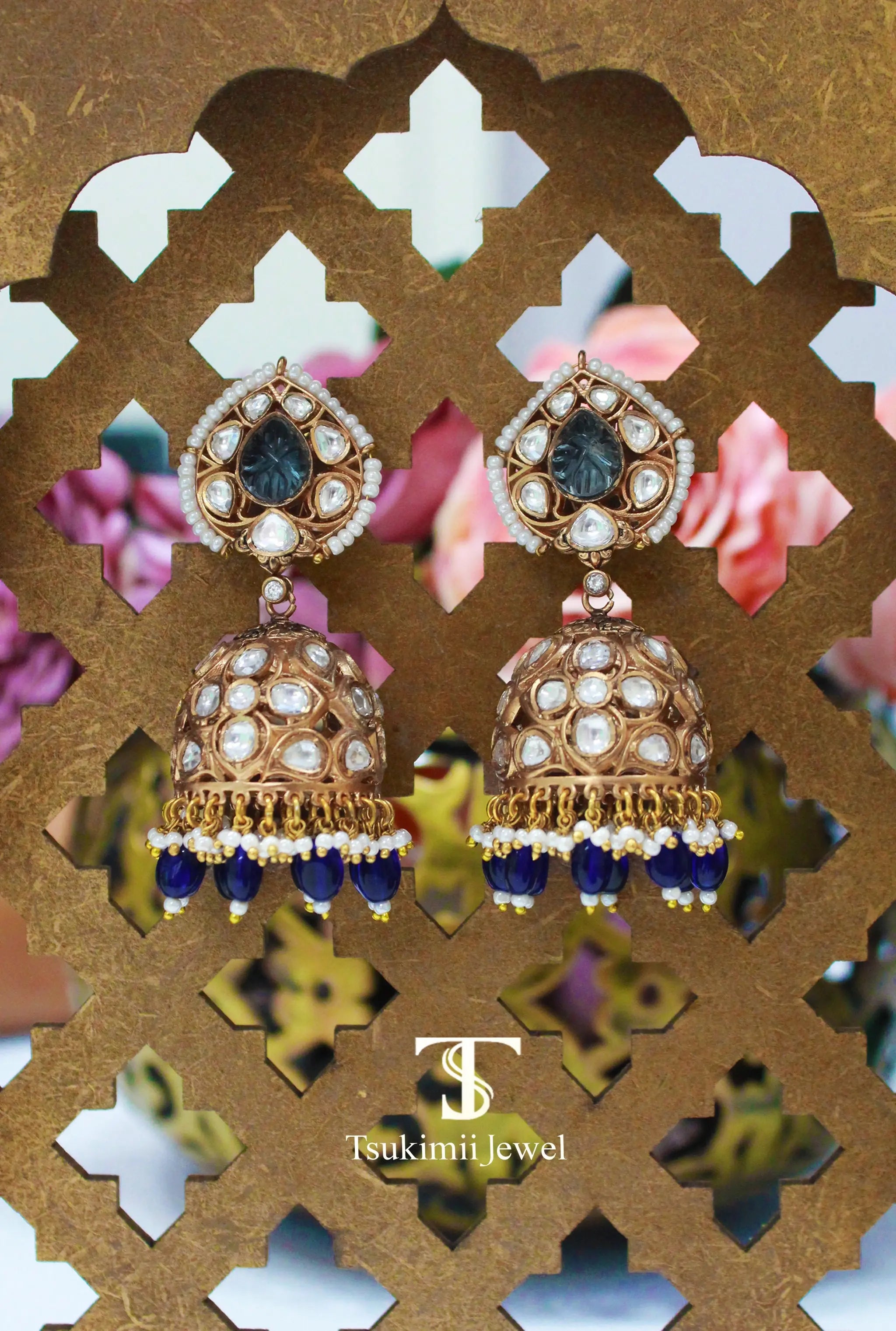 Traditional Indian jhumka earrings with detailed polki work