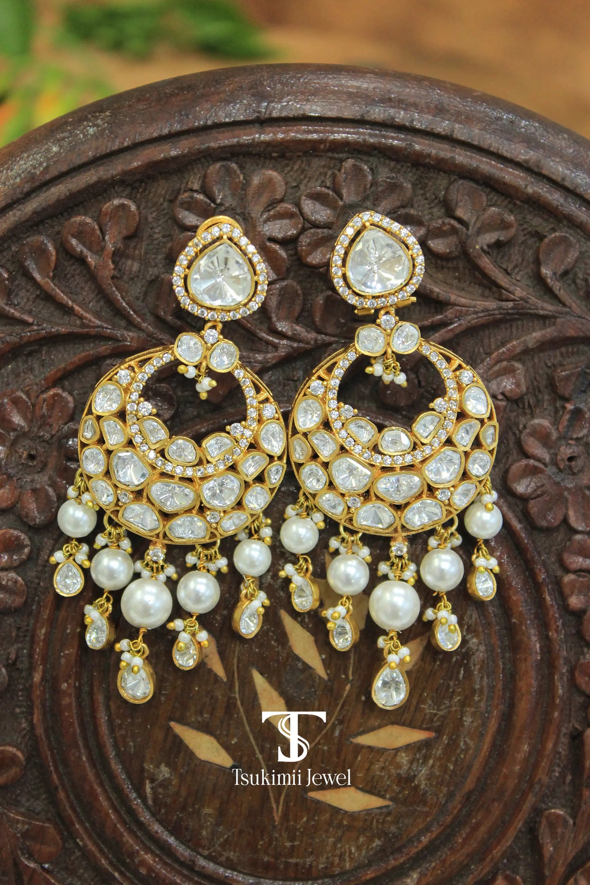 Gold finish chaandbali earrings with traditional Indian design