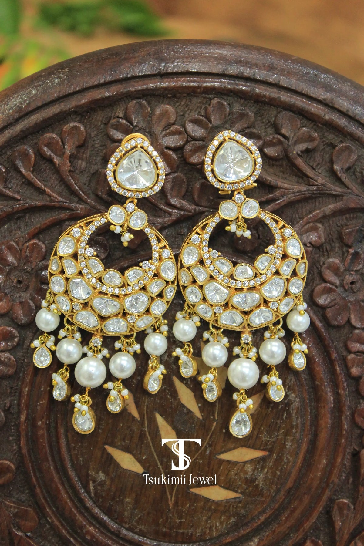 Gold finish chaandbali earrings with traditional Indian design